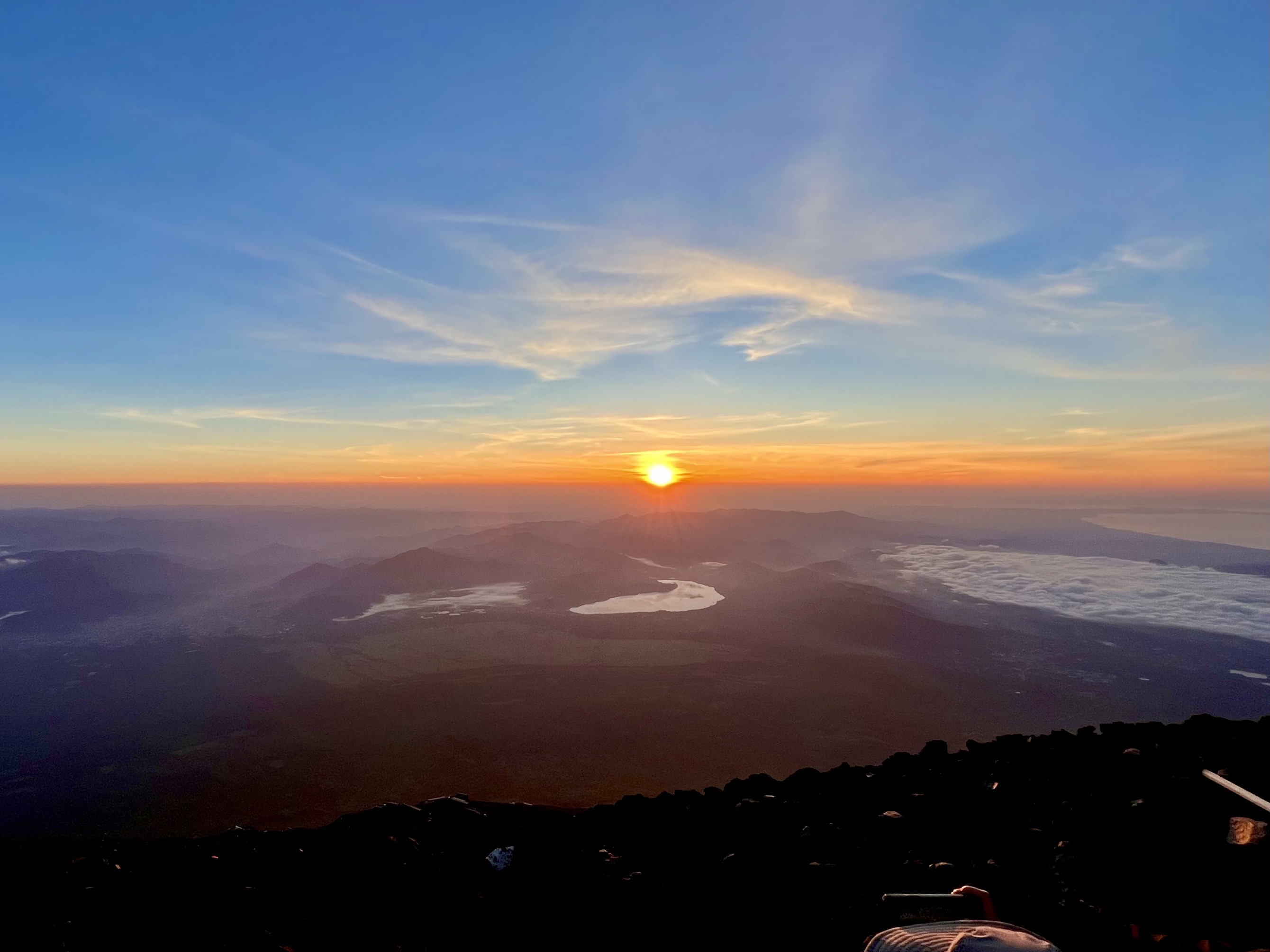 The view from the top of Mount Fuji at sunrise