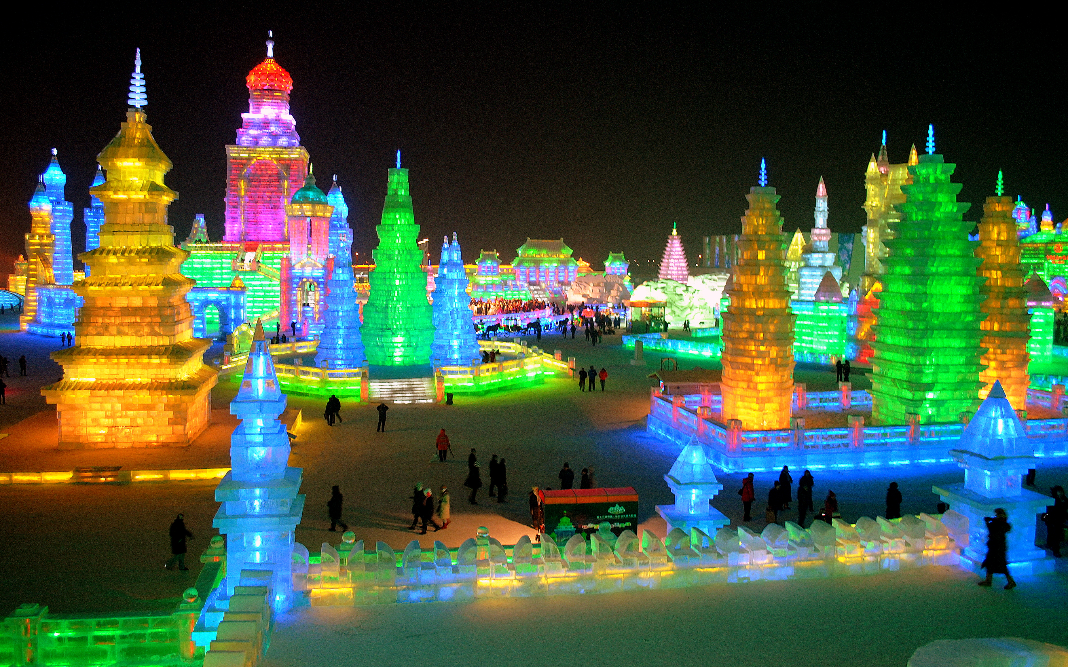 Harbin iceland, China. It is nighttime and the city is all lit up.